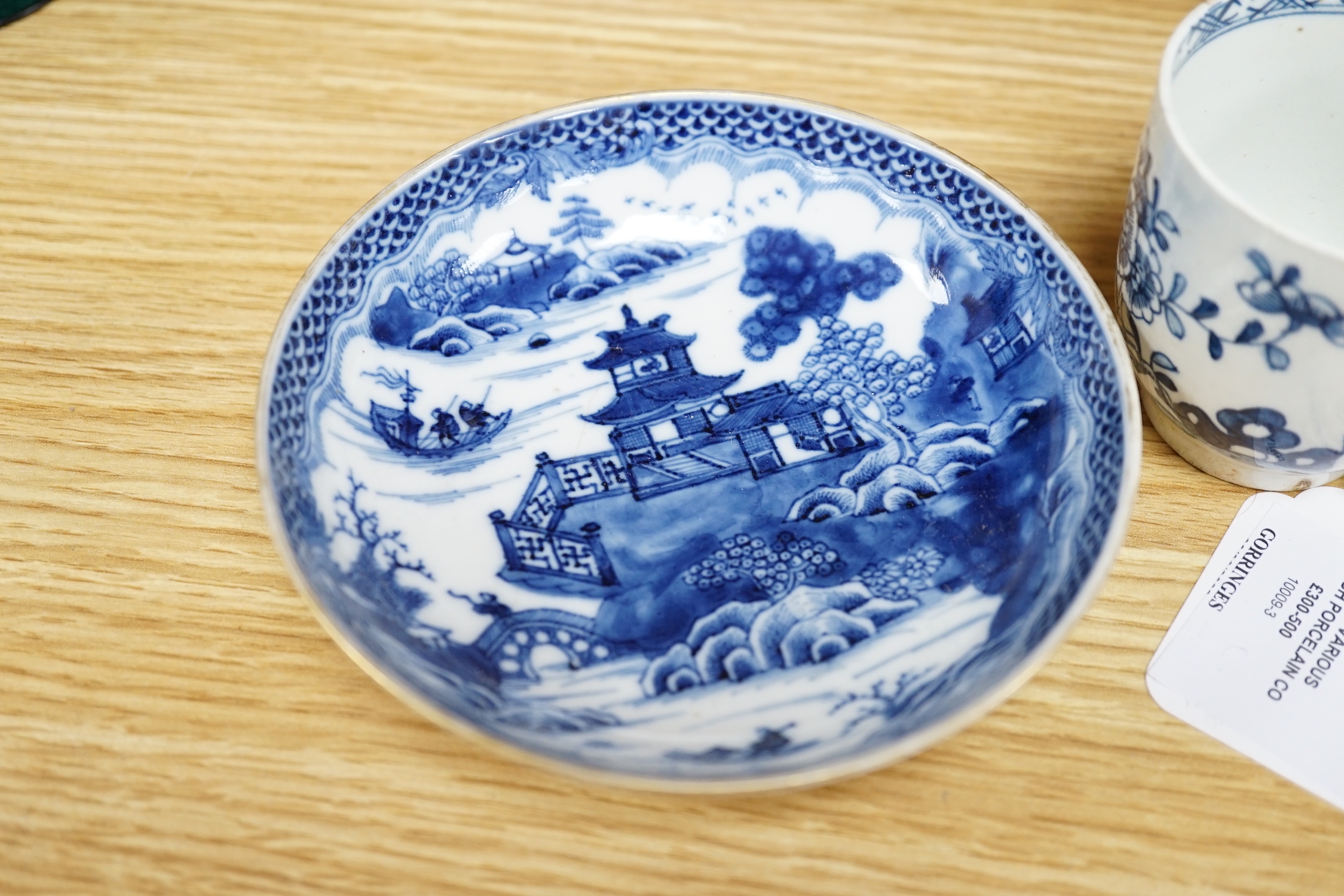 Seven various English porcelain coffee cups, including two Bristol enamelled with green floral sprays, two Bow painted in underglaze blue with a bird in a Chinese garden, and three Worcester/Bow in underglaze blue.